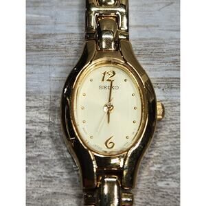 Seiko Watch Women 17mm Champagne Dial Gold Tone Oval 1N01-0CS0 New Battery